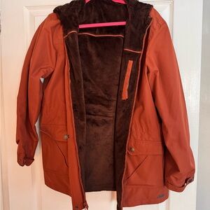 Reversible Hooded Jacket- orange windbreaker and brown fuzzy side